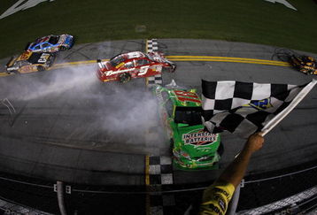 DAYTONA BEACH, FL - JULY 04:  Kyle Busch, driver of the Interstate Batteries Toyota, crashes into the wall on the final lap as he crosses the finish line and Kasey Kahne, driver of the #9 Budweiser Dodge, crashes into the back of him during the NASCAR Sprint Cup Series 51st Annual Coke Zero 400 at Daytona International Speedway on July 4, 2009 in Daytona Beach, Florida.  (Photo by Streeter Lecka/Getty Images)