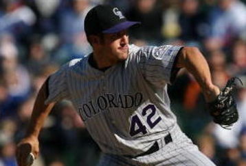 CHICAGO - APRIL 15: Huston Street of the Colorado Rockies, wearing a #42 jersey on Jackie Robinson Day, throws the ball against the Chicago Cubs on April 15, 2009 at Wrigley Field in Chicago, Illinois. The Rockies defeated the Cubs 5-2. (Photo by Jonathan Daniel/Getty Images)