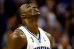 ORLANDO, FL - JUNE 11:  Dwight Howard #12 of the Orlando Magic reacts in Game Four of the 2009 NBA Finals against the Los Angeles Lakers on June 11, 2009 at Amway Arena in Orlando, Florida.  NOTE TO USER:  User expressly acknowledges and agrees that, by downloading and or using this photograph, User is consenting to the terms and conditions of the Getty Images License Agreement.  (Photo by Chris Graythen/Getty Images)