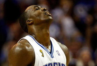 ORLANDO, FL - JUNE 11:  Dwight Howard #12 of the Orlando Magic reacts in Game Four of the 2009 NBA Finals against the Los Angeles Lakers on June 11, 2009 at Amway Arena in Orlando, Florida.  NOTE TO USER:  User expressly acknowledges and agrees that, by downloading and or using this photograph, User is consenting to the terms and conditions of the Getty Images License Agreement.  (Photo by Chris Graythen/Getty Images)