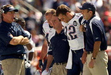 FOXBORO, MA - SEPTEMBER 7:  Quarterback Tom Brady #12 of the New England Patriots walks off the field with the aid of the Patriots staff after being injured on a play during their NFL game against the Kansas City Chiefs on September 7, 2008 at Gillette Stadium in Foxboro, Massachusetts. The Patriots defeated the Chiefs 17-10. (Photo by Elsa Garrison/Getty Images)