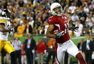TAMPA, FL - FEBRUARY 01:  Larry Fitzgerald #11 of the Arizona Cardinals celebrates after scoring on a 64-yard touchdown reception in the fourth quarter against the Pittsburgh Steelers during Super Bowl XLIII on February 1, 2009 at Raymond James Stadium in Tampa, Florida. Steelers won 27-23. (Photo by Al Bello/Getty Images)