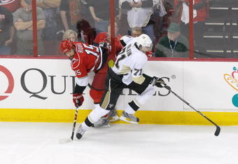 RALEIGH, NC - MAY 23: Tuomo Ruutu #15 of the Carolina Hurricanes skates against Evgeni Malkin #71 of the Pittsburgh Penguins during Game Three of the Eastern Conference Championship Round of the 2009 Stanley Cup Playoffs at RBC Center on May 23, 2009 in Raleigh, North Carolina.  (Photo by Kevin C. Cox/Getty Images)