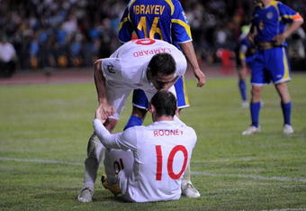 ALMATY, KAZAKHSTAN - JUNE 06:  Wayne Rooney of England is congratulated after scoring by team-mate Frank Lampard during the FIFA2010 World Cup Qualifier between Kazakhstan and England at the Central Stadium on June 6, 2009 in Almaty, Kazakhstan.  (Photo by Shaun Botterill/Getty Images)