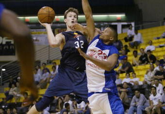 LONG BEACH, CA - JULY 14:  Mike Dunleavy #32 of the Golden State Warriors puts up a shot against Mike Batiste #23 of the Los Angeles Clippers during the Summer Pro League on March 14, 2002 at the Long Beach Pyramid in Long Beach, California.  The Clippers won 118-106.  NOTE TO USER: User expressly acknowledges and agrees that, by downloading and/or using this Photograph, User is consenting to the terms and conditions of the Getty Images License Agreement Mandatory Copyright Notice:  Copyright 2002 NBAE  (Photo by Mary Ciecek/Getty Images) 
