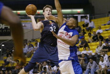 LONG BEACH, CA - JULY 14:  Mike Dunleavy #32 of the Golden State Warriors puts up a shot against Mike Batiste #23 of the Los Angeles Clippers during the Summer Pro League on March 14, 2002 at the Long Beach Pyramid in Long Beach, California.  The Clippers won 118-106.  NOTE TO USER: User expressly acknowledges and agrees that, by downloading and/or using this Photograph, User is consenting to the terms and conditions of the Getty Images License Agreement Mandatory Copyright Notice:  Copyright 2002 NBAE  (Photo by Mary Ciecek/Getty Images) 