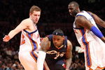 NEW YORK - FEBRUARY 04:  LeBron James #23 of the Cleveland Cavaliers dribbles past David Lee #42 and Tim Thomas #2 of the New York Knicks on February 4, 2009 at Madison Square Garden in New York City. NOTE TO USER: User expressly acknowledges and agrees that, by downloading and or using this photograph, User is consenting to the terms and conditions of the Getty Images License Agreement.  (Photo by Nick Laham/Getty Images)