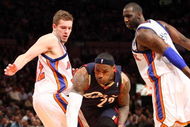 NEW YORK - FEBRUARY 04:  LeBron James #23 of the Cleveland Cavaliers dribbles past David Lee #42 and Tim Thomas #2 of the New York Knicks on February 4, 2009 at Madison Square Garden in New York City. NOTE TO USER: User expressly acknowledges and agrees that, by downloading and or using this photograph, User is consenting to the terms and conditions of the Getty Images License Agreement.  (Photo by Nick Laham/Getty Images)