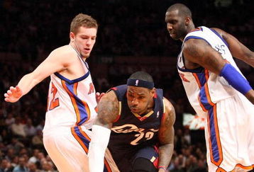 NEW YORK - FEBRUARY 04:  LeBron James #23 of the Cleveland Cavaliers dribbles past David Lee #42 and Tim Thomas #2 of the New York Knicks on February 4, 2009 at Madison Square Garden in New York City. NOTE TO USER: User expressly acknowledges and agrees that, by downloading and or using this photograph, User is consenting to the terms and conditions of the Getty Images License Agreement.  (Photo by Nick Laham/Getty Images)