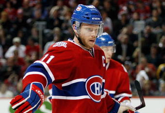 MONTREAL- APRIL 22:  Saku Koivu #11 of the Montreal Canadiens prepares for a faceoff during Game Four of the Eastern Conference Quarterfinals of the 2009 Stanley Cup Playoffs against the Boston Bruins at the Bell Centre on April 22, 2009 in Montreal, Quebec, Canada.  The Bruins defeated the Canadiens 4-1 winning the series 4-0.  (Photo by Richard Wolowicz/Getty Images)
