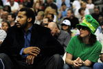 DALLAS - MARCH 17:  NBA fan, Amy Hill of Disney, Oklahoma watches a game while sitting next to Rasheed Wallace of the Detroit Pistons during play against the Dallas Mavericks on March 17, 2009 at American Airlines Center in Dallas, Texas.  NOTE TO USER: User expressly acknowledges and agrees that, by downloading and/or using this Photograph, user is consenting to the terms and conditions of the Getty Images License Agreement.  (Photo by Ronald Martinez/Getty Images)