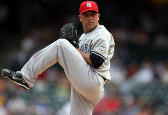 ARLINGTON, TX - MAY 25:  Pitcher Alfredo Aceves #91 of the New York Yankees throws against the Texas Rangers in the 9th inning on May 25, 2009 at Rangers Ballpark in Arlington, Texas.  (Photo by Ronald Martinez/Getty Images)
