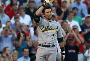 BOSTON - JULY 6: Nomar Garciaparra #1 of the Oakland Athletics tips his hat to the crowds applause during his first return to Fenway Park against the Boston Red Sox on July 6, 2009 in Boston, Massachusetts. (Photo by Elsa/Getty Images)