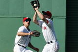 BOSTON - JULY 05:  J.D. Drew #7 of the Boston Red Sox makes the catch for the out as teammate Jacoby Ellsbury #46 looks on in the ninth inning against the Seattle Mariners on July 5, 2009 at Fenway Park in Boston, Massachusetts. The Red Sox defeated the Mariners 8-4.  (Photo by Elsa/Getty Images)