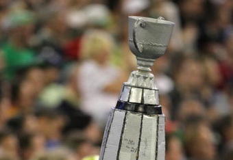 TORONTO, ON - NOVEMBER 25:  A Saskatchewan Rough Riders fan holds up a replica of the Grey Cup in a victory over the Winnipeg Blue Bombers during the 95th Grey Cup on November 25, 2007 at the Rogers Centre in Toronto, Ontario, Canada.  (Photo by Harry How/Getty Images)
