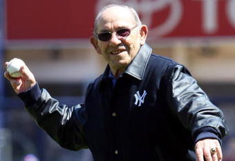 NEW YORK - APRIL 16: Yogi Berra throws the ceremonial first pitch before the opening day game between the Cleveland Indians and the New York Yankees at the new Yankee Stadium on April 16, 2009 in the Bronx borough of New York City. This is the first regular season MLB game being played at the new venue which replaced the old Yankee Stadium as the Yankees home field. (Photo by Jim McIsaac/Getty Images) 