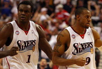 PHILADELPHIA - APRIL 26:  Andre Iguodala #9 and Samuel Dalembert #1 of the Philadelphia 76ers react after a basket against the Orlando Magic during Game Four of the Eastern Conference Quarterfinals during the 2009 NBA Playoffs at the Wachovia Center on April 26, 2009 in Philadelphia, Pennsylvania. Orlando defeated Philadelphia 84-81 to even the series at 2 games each. NOTE TO USER: User expressly acknowledges and agrees that, by downloading and/or using this Photograph, user is consenting to the terms and conditions of the Getty Images License Agreement.  (Photo by Jim McIsaac/Getty Images)