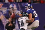 EAST RUTHERFORD, NJ - DECEMBER 17:  Jeremy Shockey #80 of the New York Giants can't come up with a reception as Brian Dawkins #20 of the Philadelphia Eagles defends on December 17, 2006 at Giants Stadium in East Rutherford, New Jersey. The Eagles defeated the Giants 36-22.  (Photo by Jim McIsaac/Getty Images)