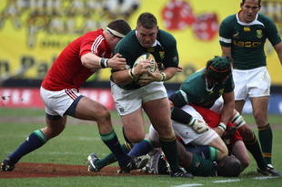 JOHANNESBURG, SOUTH AFRICA - JULY 04:  Jon Smit, the South African captain charges upfield during the Third Test match between South African and the British and Irish Lions at Ellis Park Stadium on July 4, 2009 in Johannesburg, South Africa. (Photo by David Rogers/Getty Images)