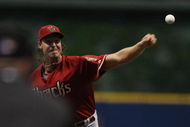 MILWAUKEE - JUNE 03: Randy Johnson #51 of the Arizona Diamondbacks pitches in the first inning on his way to passing Roger Clemens for second place on the all-time strikeout list against the Milwaukee Brewers on June 3, 2008 at Miller Park in Milwaukee, Wisconsin. (Photo by Jonathan Daniel/Getty Images)