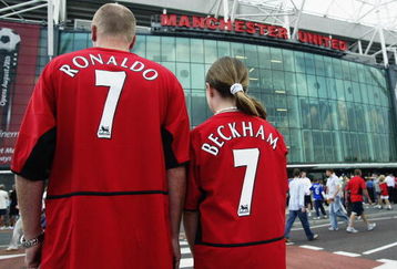 MANCHESTER - AUGUST 16:  Manchester United fans wearing new boy Cristiano Ronaldo and recently departed David Beckham shirts during the FA Barclaycard Premiership match between Manchester United and Bolton Wanderers held on August 16, 2003 at Old Trafford, in Manchester, England. Manchester United won the match 4-0. (Photo by Alex Livesey/Getty Images)