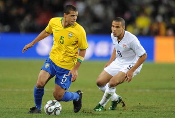 JOHANNESBURG, SOUTH AFRICA - JUNE 28: Felipe Melo of Brazil and Charlie Davis of USA comete during the 2009 Confederations Cup final match between Brazil and USA from Ellis Park on June 28, 2009 in Johannesburg, South Africa. (Photo by Lefty Shivambu/Gallo Images/Getty Images)