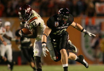 MIAMI - JANUARY 01:  Kam Chancellar #17 intercepts the ball against Ben Guidugli #19 of the Virginia Tech Hokies of the Virginia Tech Hokies Cincinnati Bearcats during the FedEx Orange Bowl at Dolphin Stadium on January 1, 2009 in Miami, Florida.  (Photo by Marc Serota/Getty Images)