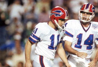 TAMPA, FL - JANUARY 27:  Kicker Scott Norwood #11 and  quarterback Frank Reich #14 of the Buffalo Bills walk n the field during Super Bowl XXV against the New York Giants at Tampa Stadium on January 27, 1991 in Tampa, Florida.  The Giants won 20-19.  (Photo by George Rose/Getty Images)