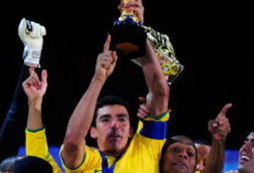 JOHANNESBURG, SOUTH AFRICA - JUNE 28:  Lucio of Brazil lifts the trophy as his team mates celebrate following their victory at the end of the FIFA Confederations Cup Final between USA and Brazil at the Ellis Park Stadium on June 28, 2009 in Johannesburg, South Africa.  (Photo by Jamie McDonald/Getty Images)