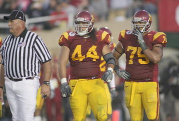 PASADENA, CA - JANUARY 1:  Christian Tupou #44 of the USC Trojans and Fili Moala #75 look on against the Penn State Nittany Lions on January 1, 2009 at the Rose Bowl in Pasadena, California.  USC won 38-24.  (Photo by Jeff Golden/Getty Images)