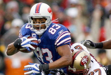ORCHARD PARK, NY - NOVEMBER 30: Lee Evans #83  of the Buffalo Bills is tackled by Walt Harris #27 of the San Francisco 49ers  on November 30, 2008 at Ralph Wilson Stadium in Orchard Park, New York.  (Photo by Rick Stewart/Getty Images)