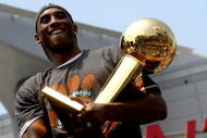 LOS ANGELES, CA - JUNE 17:  Kobe Bryant #24 holds the Larry O'Brien trophy as he rides on the top of a double decker bus at the start of the Los Angeles Lakers NBA championship victory parade outside the Staples Center on June 17, 2009 in Los Angeles, California.  (Photo by Stephen Dunn/Getty Images)