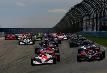 WATKINS GLEN, NY - JULY 05: Ryan Briscoe driving the #6 Team Penske Dallara Honda and Justin Wilson in the #18 Z-Line Design Dale Coyne Racing Dallara Honda lead the field into turn one at the start of the IRL IndyCar Series Camping World Grand Prix at The Glen on July 5, 2009 at the Watkins Glen International in Watkins Glen, New York.  (Photo by Darrell Ingham/Getty Images)