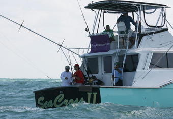 MIAMI - MARCH 26:  Frank Dancevic (red shirt) aboard a charter fishing boat prior to the Sony Ericsson Open on March 26, 2009 in Miami, Florida.  (Photo by Marc Serota/Getty Images for Sony Ericsson)