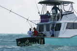 MIAMI - MARCH 26:  Frank Dancevic (red shirt) aboard a charter fishing boat prior to the Sony Ericsson Open on March 26, 2009 in Miami, Florida.  (Photo by Marc Serota/Getty Images for Sony Ericsson)