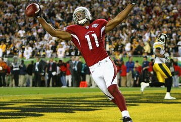 TAMPA, FL - FEBRUARY 01:  Larry Fitzgerald #11 of the Arizona Cardinals celebrates after scoring a touchdown in the fourth quarter against the Pittsburgh Steelers during Super Bowl XLIII on February 1, 2009 at Raymond James Stadium in Tampa, Florida.  (Photo by Al Bello/Getty Images)