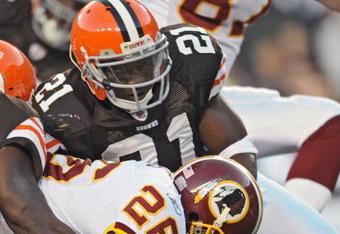 LANDOVER, MD - OCTOBER 19: Running back Clinton Portis #26 of the Washington Redskins stretches the ball over the goal-line for a touchdown, while being pulled back by safety Brodney Pool #21 of the Cleveland Browns on October 19, 2008 at FedEx Field in Landover, Maryland. (Photo by Drew Hallowell/Getty Images)