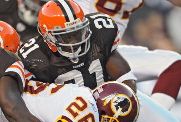 LANDOVER, MD - OCTOBER 19: Running back Clinton Portis #26 of the Washington Redskins stretches the ball over the goal-line for a touchdown, while being pulled back by safety Brodney Pool #21 of the Cleveland Browns on October 19, 2008 at FedEx Field in Landover, Maryland. (Photo by Drew Hallowell/Getty Images)