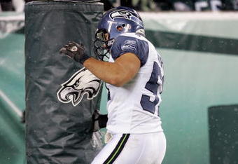 PHILADELPHIA - DECEMBER 05:  Lofa Tatupu #51 of the Seattle Seahawks celebrates his touchdown in the second quarter by punching the goal post during the game against the Philadelphia Eagles giving the Seahawks a 21-0 lead on December 5, 2005 at Lincoln Financial Field in Philadelphia, Pennsylvannia.  (Photo by Jamie Squire/Getty Images)