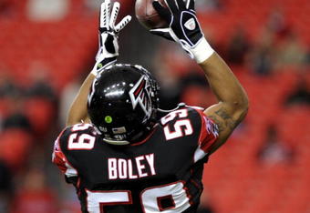 ATLANTA - DECEMBER 14: Linebacker Michael Boley #59 of the Atlanta Falcons grabs a warm-up pass before play against the Tampa Bay Buccaneers  at the Georgia Dome on December 14, 2008 in Atlanta, Georgia.  (Photo by Al Messerschmidt/Getty Images) 
