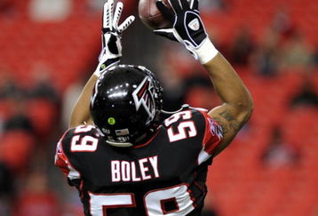 ATLANTA - DECEMBER 14: Linebacker Michael Boley #59 of the Atlanta Falcons grabs a warm-up pass before play against the Tampa Bay Buccaneers  at the Georgia Dome on December 14, 2008 in Atlanta, Georgia.  (Photo by Al Messerschmidt/Getty Images) 