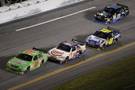 DAYTONA BEACH, FL - JULY 04: Kyle Busch driver of the #18 Interstate Batteries Toyota leads Tony Stewart driver of the #14 Burger King Chevrolet during the NASCAR Sprint Cup Series 51st Annual Coke Zero 400 at Daytona International Speedway on July 4, 2009 in Daytona Beach, Florida.  (Photo by John Harrelson/Getty Images for NASCAR)