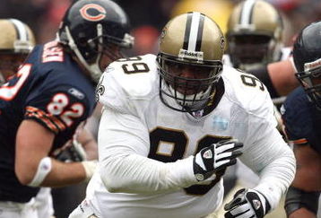 CHICAGO - DECEMBER 30:  Hollis Thomas #99 of the New Orleans Saints rushes the passer against the Chicago Bears at Soldier Field on December 30, 2007 in Chicago, Illinois.  (Photo by Jonathan Daniel/Getty Images)