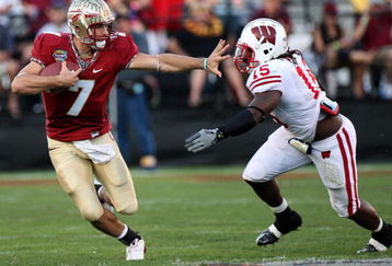 ORLANDO, FL - DECEMBER 27:  Christian Ponder #7 of the Florida State Seminoles attempts to avoid the tackle of Culmer St. Jean #15 of the Wisconsin Badgers during the Champs Bowl on December 27, 2008 at the Citrus Bowl in Orlando, Florida.  (Photo by Sam Greenwood/Getty Images)