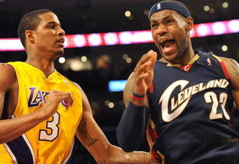 LOS ANGELES, CA - JANUARY 19:  (R) LeBron James #23 of the Cleveland Cavaliers reacts after a play next to Trevor Ariza #3 of the Los Angeles Lakers during the game at Staples Center on January 19, 2009 in Los Angeles, California.  The Lakers defeated the Cavaliers 105-88.  (Photo by Harry How/Getty Images)
