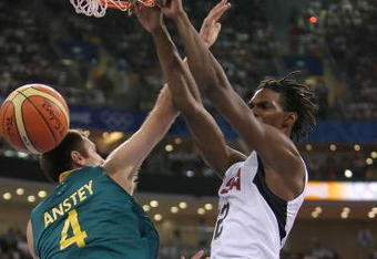 BEIJING - AUGUST 20:  Chris Bosh #12 of the United States dunks over the defense of Chris Anstey #4 of Australia during the men's basketball quarterfinal game at the Olympic Basketball Gymnasium during Day 12 of the Beijing 2008 Olympic Games on August 20, 2008 in Beijing, China.  (Photo by Streeter Lecka/Getty Images)