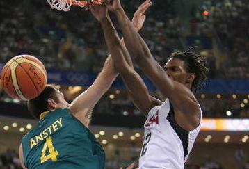 BEIJING - AUGUST 20:  Chris Bosh #12 of the United States dunks over the defense of Chris Anstey #4 of Australia during the men's basketball quarterfinal game at the Olympic Basketball Gymnasium during Day 12 of the Beijing 2008 Olympic Games on August 20, 2008 in Beijing, China.  (Photo by Streeter Lecka/Getty Images)