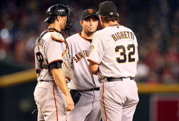 PHOENIX - JUNE 11:  Starting pitcher Jonathan Sanchez #57 of the San Francisco Giants meets with catcher Eli Whiteside #22 and coach Dave Righetti on the mound during the major league baseball game against the Arizona Diamondbacks at Chase Field on June 11, 2009 in Phoenix, Arizona.  The Diamondbacks defeated the Giants 2-1.  (Photo by Christian Petersen/Getty Images)