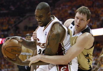 CLEVELAND - APRIL 21:  Joe Smith #32 of the Cleveland Cavaliers gets fouled by  Darius Songaila #9 of the Washington Wizards in Game Two of the Eastern Conference Quarterfinals during the 2008 NBA Playoffs at Quicken Loans Arena April 21, 2008 in Cleveland, Ohio. Cleveland won the game 116-86. NOTE TO USER: User expressly acknowledges and agrees that, by downloading and or using this photograph, User is consenting to the terms and conditions of the Getty Images License Agreement.  (Photo by Gregory Shamus/Getty Images)