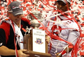 NEW ORLEANS - JANUARY 02:  Head coach Kyle Whittingham and quarterback Brian Johnson #3 of the Utah Utes celebrates after defeating the Alabama Crimson Tide 31-17 during the 75th Allstate Sugar Bowl at the Louisiana Superdome on January 2, 2009 in New Orleans, Louisiana.  (Photo by Matthew Stockman/Getty Images)